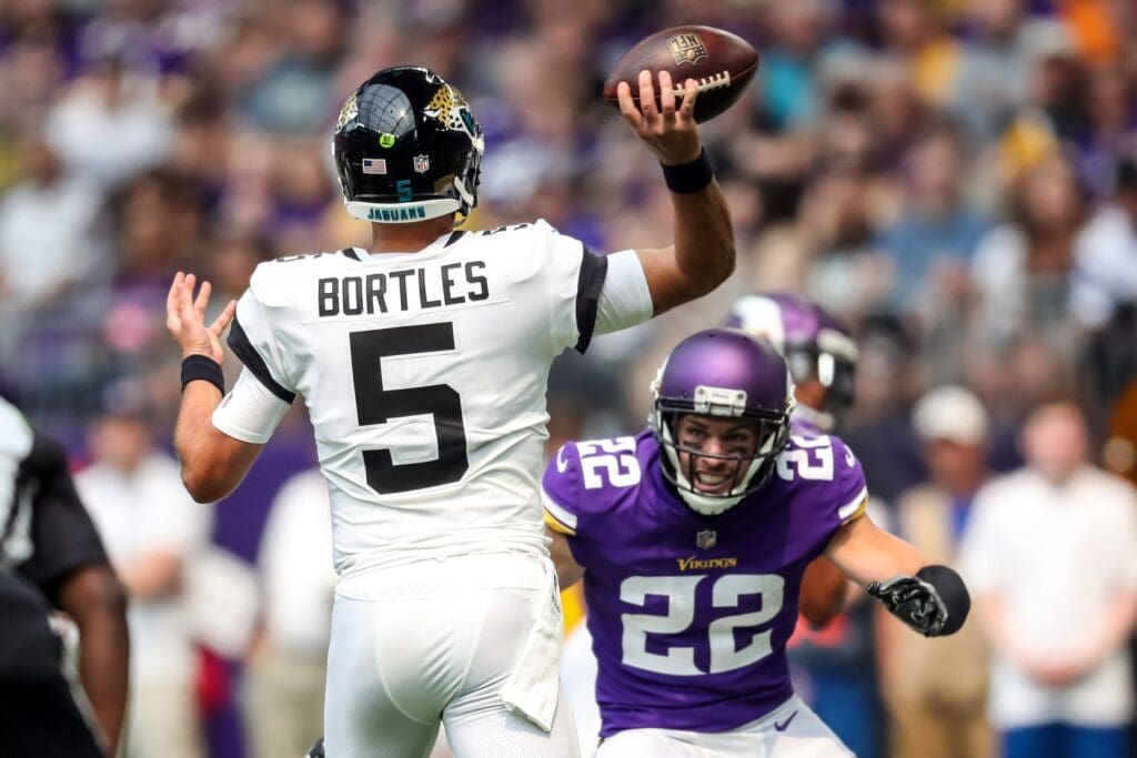 Aug 18, 2018; Minneapolis, MN, USA; Jacksonville Jaguars quarterback Blake Bortles (5) throws over Minnesota Vikings safety Harrison Smith (22) during the first quarter at U.S. Bank Stadium