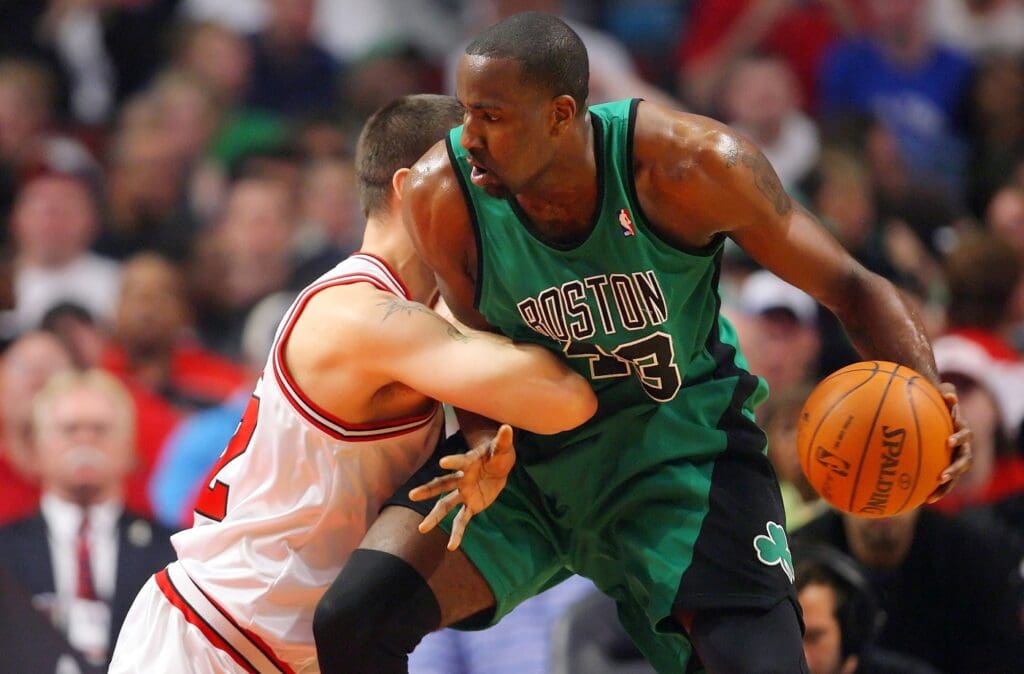 Apr 13, 2010; Chicago, IL, USA; Boston Celtics center Kendrick Perkins (43) is defended by Chicago Bulls center Brad Miller (52) during the first half at the United Center.