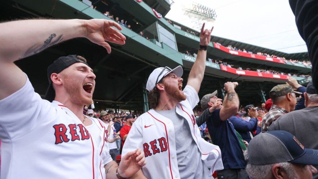 Apr 4, 2025; Boston, Massachusetts, USA; Boston Red Sox fans cheer after a home run by Boston Red Sox right fielder Wilyer Abreu (52) during the first inning against the St. Louis Cardinals at Fenway Park.