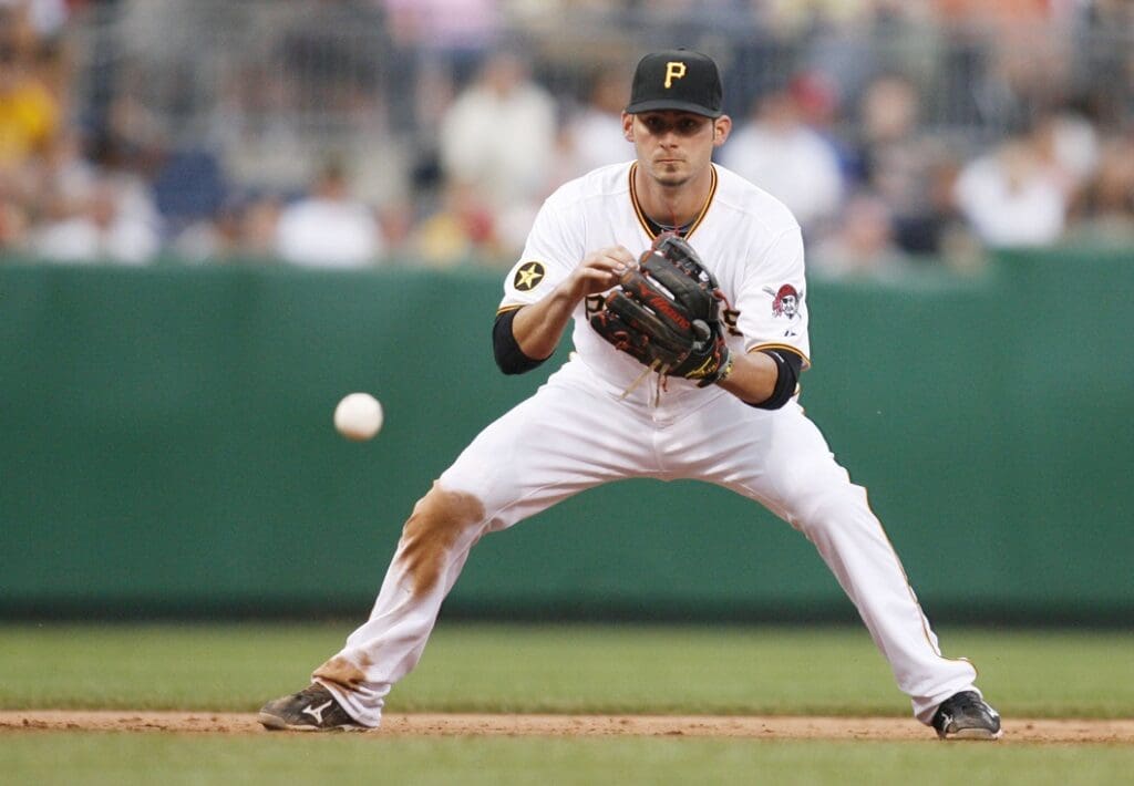 Caption:
August 20, 2011; Pittsburgh,PA, USA: Pittsburgh Pirates third baseman Brandon Wood (2) fields a ground ball against the Cincinnati Reds during the ninth inning at PNC Park. The Pirates won 5-3.