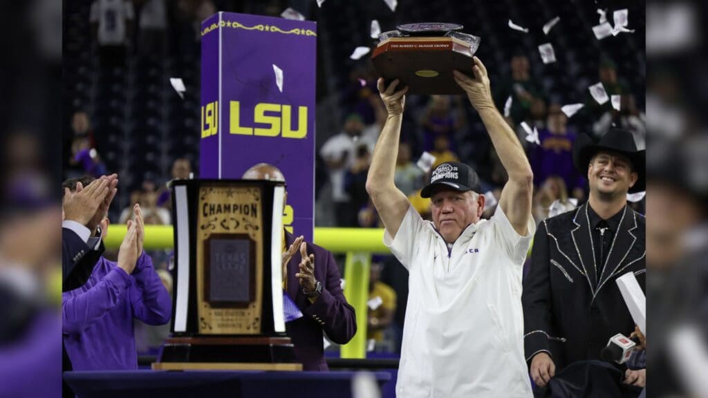 Dec 31, 2024; Houston, TX, USA; LSU Tigers head coach Brian Kelly holds up the trophy after defeating the Baylor Bears in the Kinder’s Texas Bowl in the second half at NRG Stadium.