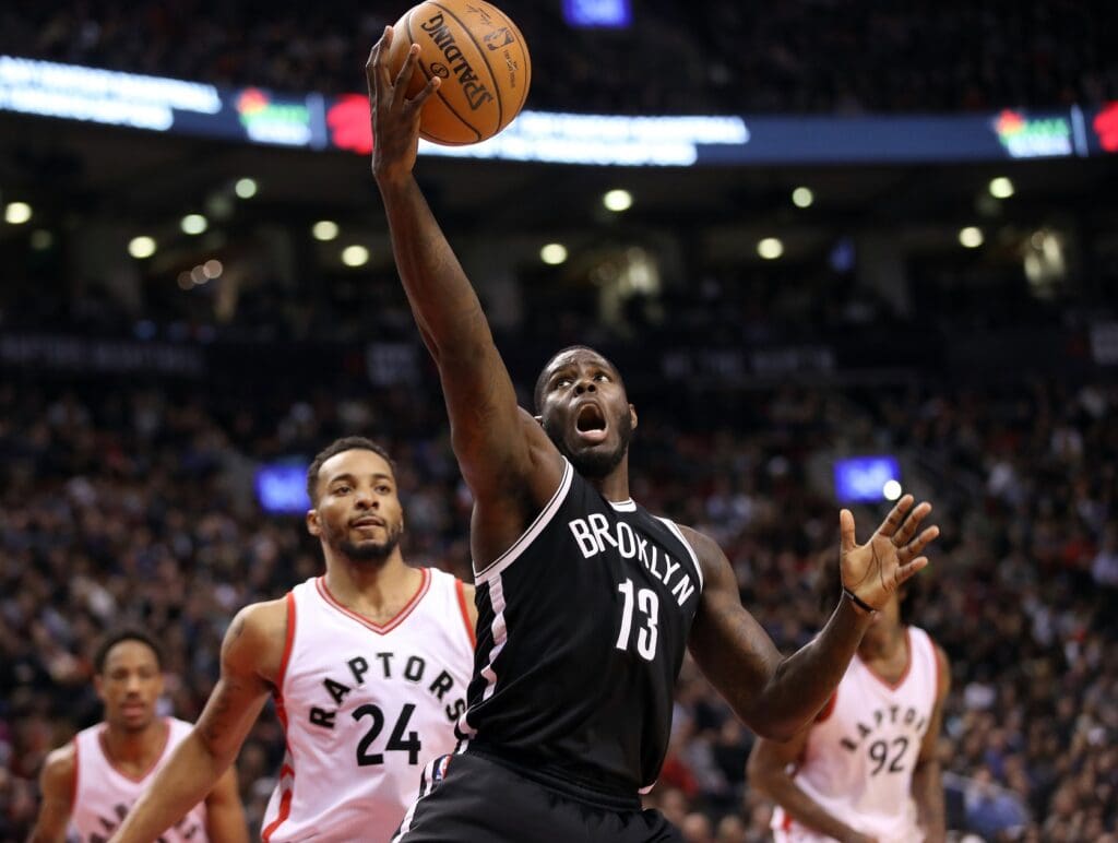 Dec 20, 2016; Toronto, Ontario, CAN; Brooklyn Nets forward Anthony Bennett (13) rebounds against the Toronto Raptors at Air Canada Centre. The Raptors beat the Nets 116-104.