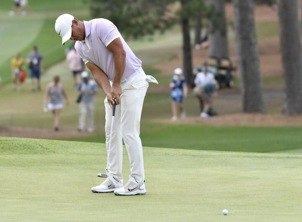 Apr 13, 2019; Augusta, GA, USA; Brooks Koepka putts on the 7th green during the third round of The Masters golf tournament at Augusta National Golf Club