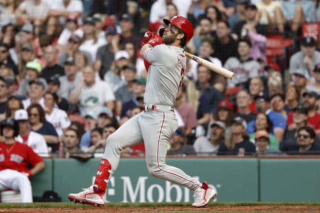 Jul 10, 2021; Boston, Massachusetts, USA; Philadelphia Phillies right fielder Bryce Harper (3) follows through on a two run double against the Boston Red Sox during the eighth inning at Fenway Park.