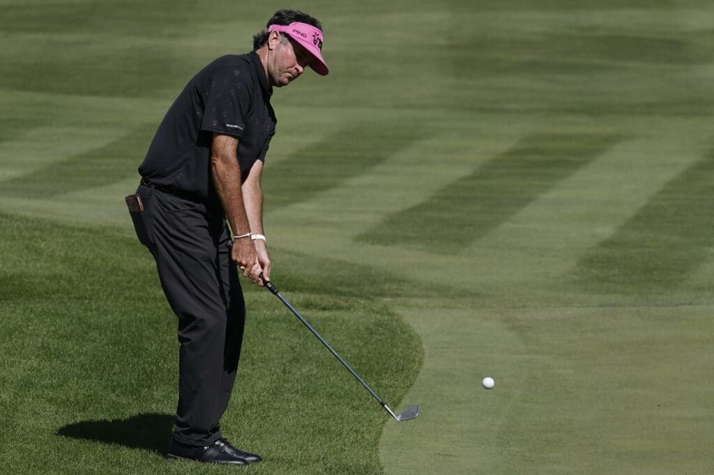 Jun 7, 2025; Gainesville, Virginia, USA; Bubba Watson of team RangeGoats GC pitches onto the fourteenth green during the second round of the LIV Golf Virginia golf tournament at Robert Trent Jones Golf Club.