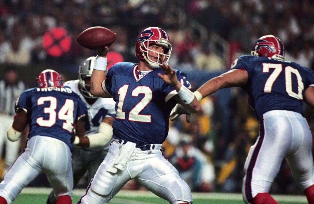 Jan 30, 1994; Atlanta, GA, USA; FILE PHOTO; Buffalo Bills quarterback Jim Kelly (12) looks to throw against the Dallas Cowboys during Super Bowl XXVIII at the Georgia Dome. Dallas defeated Buffalo 30-13.
