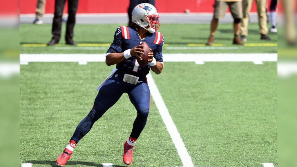 Sep 13, 2020; Foxborough, Massachusetts, USA; New England Patriots quarterback Cam Newton (1) looks to pass against the Miami Dolphins during the first quarter at Gillette Stadium