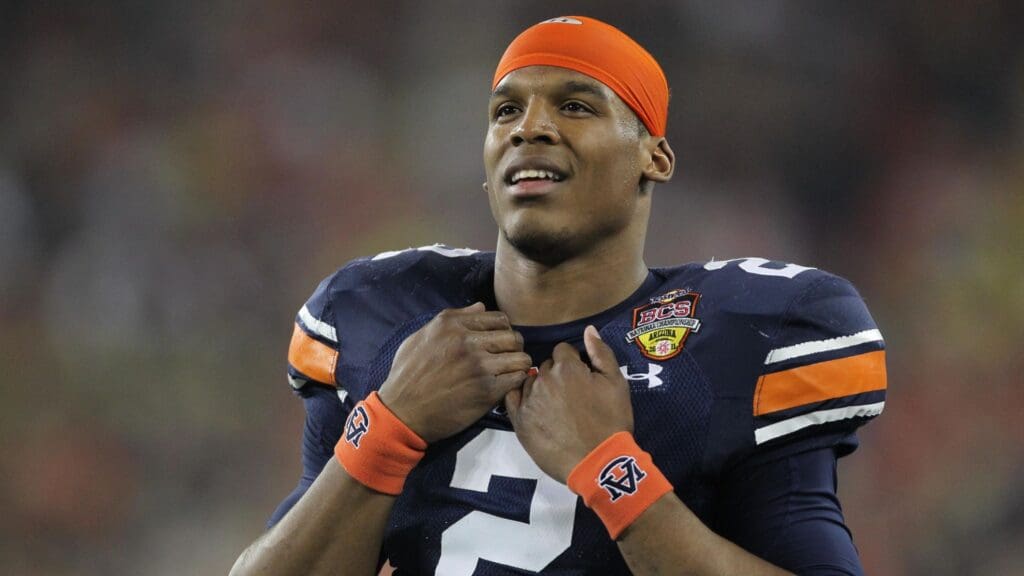 Jan 10, 2011; Glendale, AZ, USA; Auburn Tigers quarterback Cam Newton (2) watches from the sidelines during the first quarter of the 2011 BCS National Championship game against the Oregon Ducks at University of Phoenix Stadium.