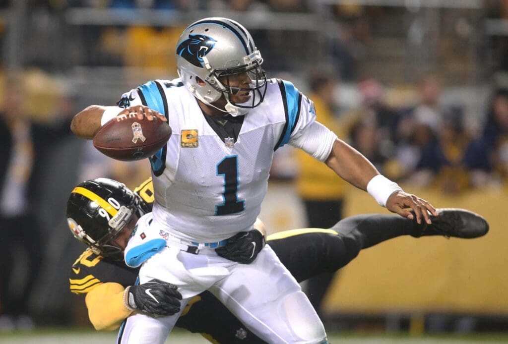 Nov 8, 2018; Pittsburgh, PA, USA; Carolina Panthers quarterback Cam Newton (1) pass under pressure from Pittsburgh Steelers outside linebacker T.J. Watt (90) during the first quarter at Heinz Field.