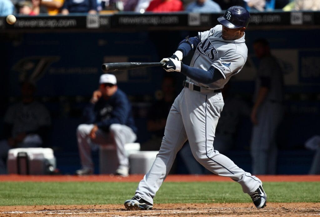 Sep 11, 2010; Toronto, ON, Canada; Tampa Bay Rays left fielder Carl Crawford (13) hits a 2-run triple in the 6th inning against the Toronto Blue Jays at the Rogers Centre. The Rays beat the Blue Jays 13-1.