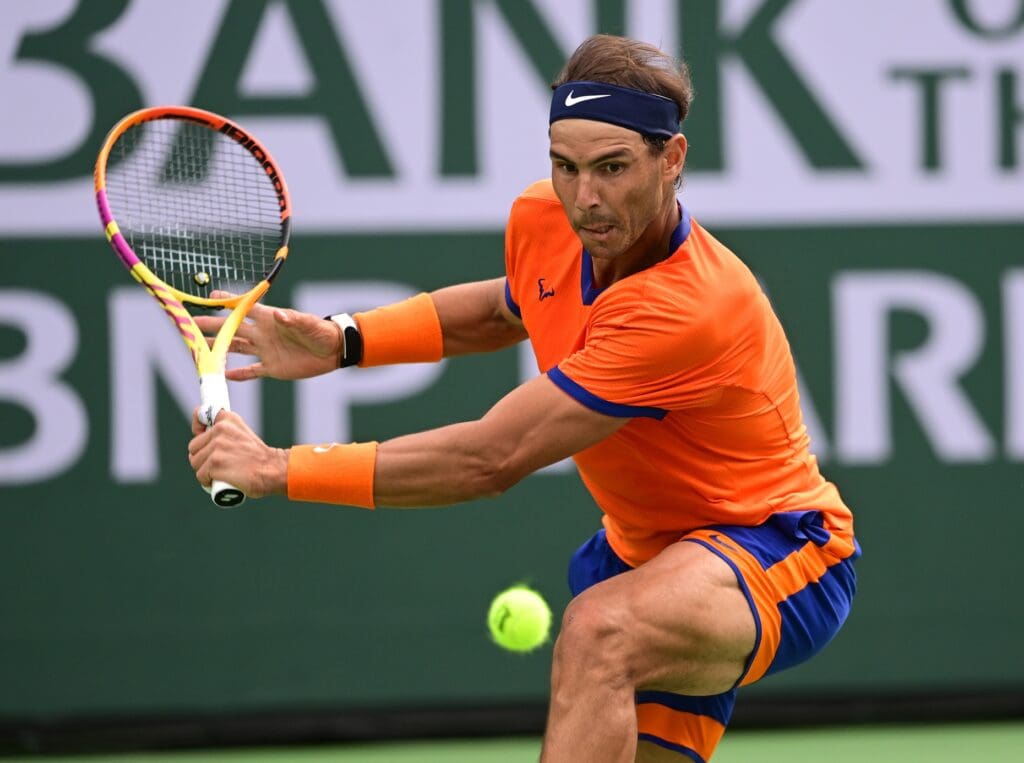 Mar 19, 2022; Indian Wells, CA, USA; Rafael Nadal (ESP) hits a shot during a victory over Carlos Alcaraz (ESP) in their semifinal match in the BNP Paribas Open at the Indian Wells Tennis Garden.