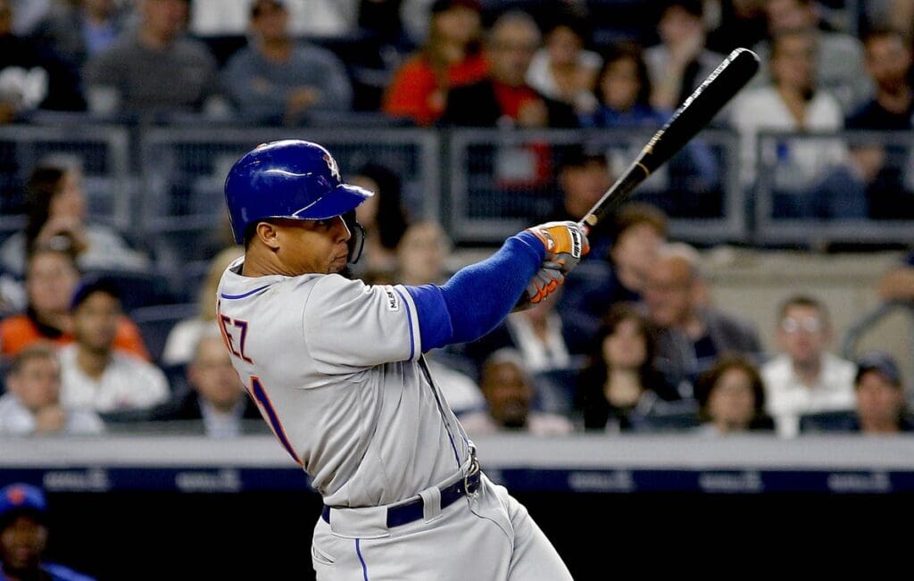 Jun 11, 2019; Bronx, NY, USA; New York Mets center fielder Carlos Gomez (91) hits a solo home run against the New York Yankees during the fifth inning of game two of a doubleheader at Yankee Stadium.