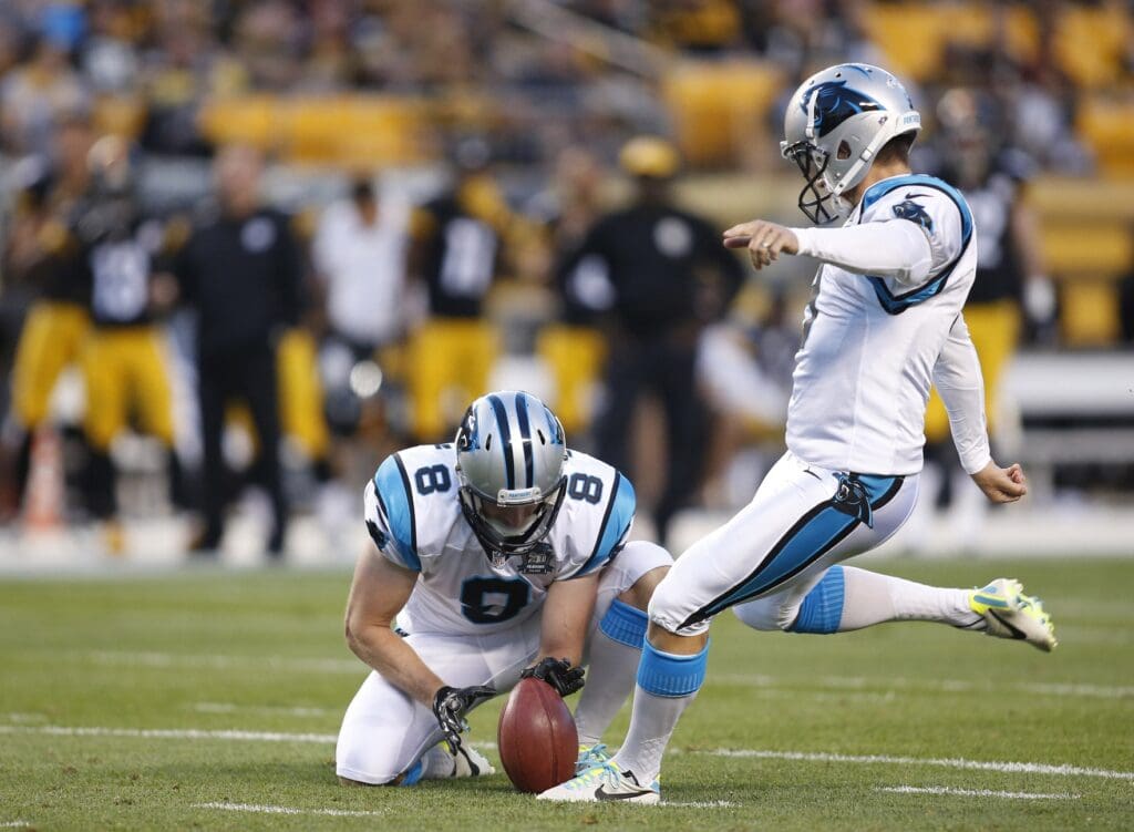 Aug 28, 2014; Pittsburgh, PA, USA; Carolina Panthers kicker Graham Gano (9) kicks a 33 yard field goal from the hold of punter Brad Nortman (8) against the Pittsburgh Steelers during the first quarter at Heinz Field.