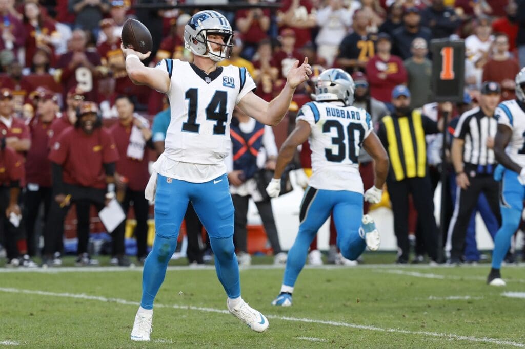 Carolina Panthers quarterback Andy Dalton (14) passes the ball against the Washington Commanders during the second quarter at Northwest Stadium.