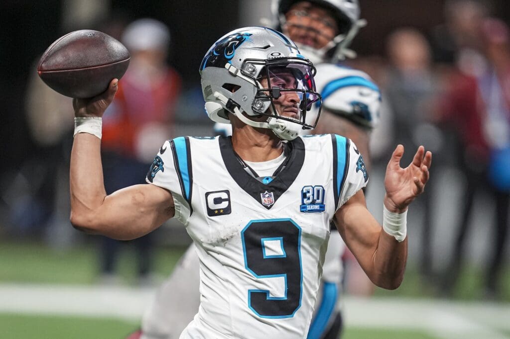 Jan 5, 2025; Atlanta, Georgia, USA; Carolina Panthers quarterback Bryce Young (9) passes on the run against the Atlanta Falcons during the second half at Mercedes-Benz Stadium.