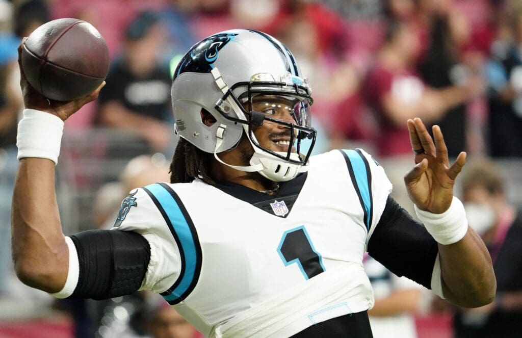 Nov 14, 2021; Glendale, Arizona, USA; Carolina Panthers quarterback Cam Newton (1) smiles during the pregame warm-up against the Arizona Cardinals at State Farm Stadium.