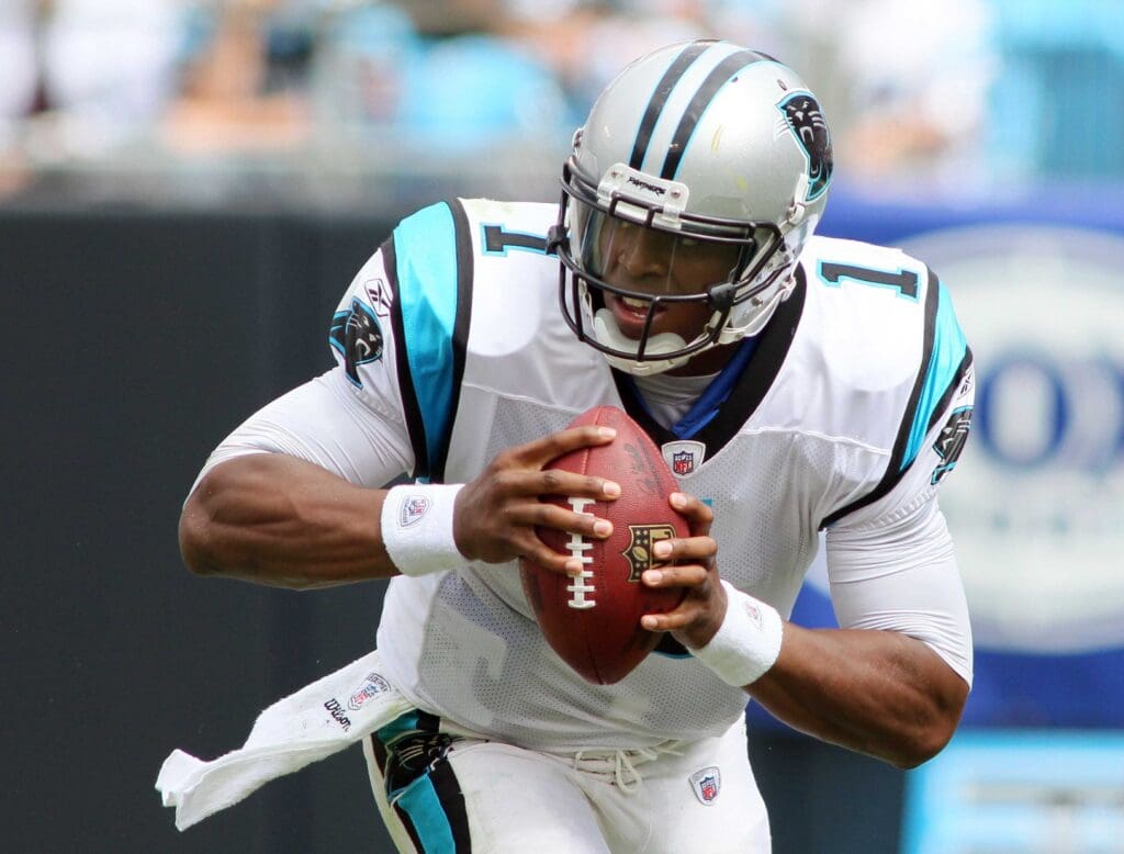 Sep 18, 2011; Charlotte, NC, USA; Carolina Panthers quarterback Cam Newton (1) looks to pass the ball during the second quarter against the Green Bay Packers at Bank of America Stadium. The Packers defeated the Panthers 30-23.