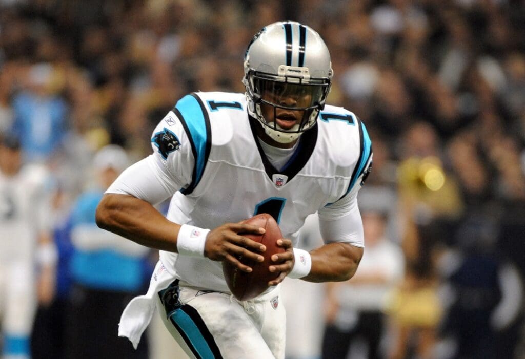 January 1, 2012; New Orleans, LA, USA; Carolina Panthers quarterback Cam Newton (1) runs with the football against the New Orleans Saints at the Mercedes-Benz Superdome.