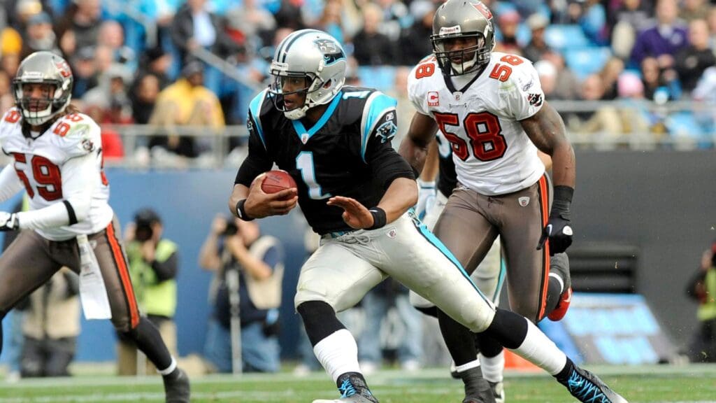 December 24, 2011; Charlotte, NC, USA; Carolina Panthers quarterback Cam Newton (1) scrambles down field during the game against the Tampa Bay Buccaneers at Bank of America Stadium. Carolina Panthers win 48-16.