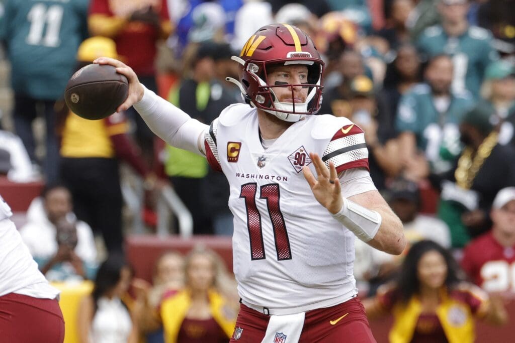 Sep 25, 2022; Landover, Maryland, USA; Washington Commanders quarterback Carson Wentz (11) passes the ball against the Philadelphia Eagles at FedExField