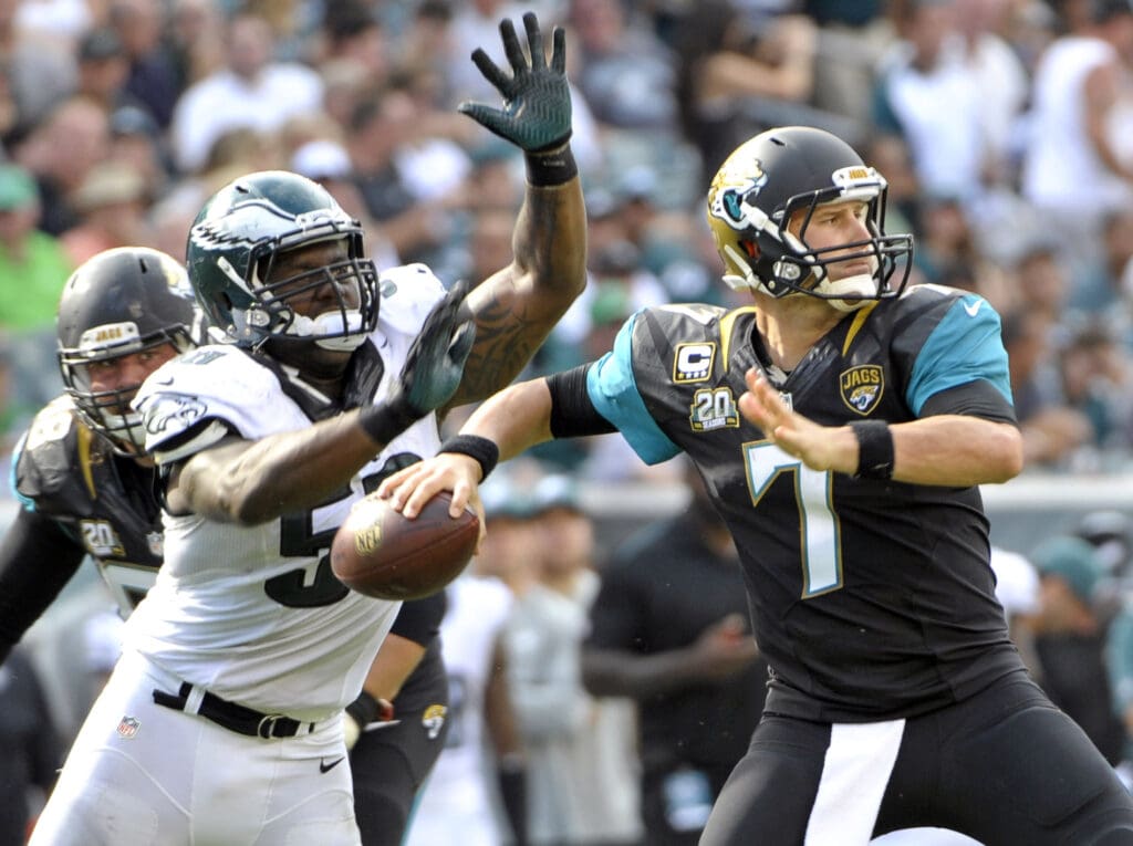 Sep 7, 2014; Philadelphia, PA, USA; Philadelphia Eagles outside linebacker Trent Cole (58) strips the football from Jacksonville Jaguars quarterback Chad Henne (7) in the fourth quarter at Lincoln Financial Field. Philadelphia Eagles defensive end Fletcher Cox (not pictured) returned it for a touchdown. The Eagles defeated the Jaguars, 34-17.