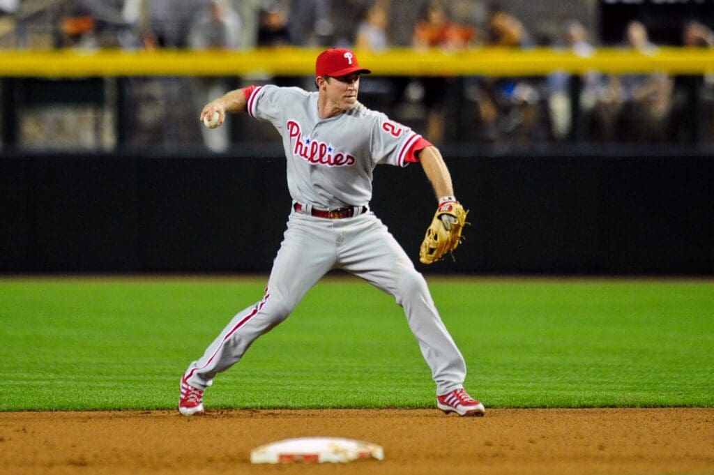 May 9, 2013; Phoenix, AZ, USA; Philadelphia Phillies second baseman Chase Utley (26) goes after a ground ball during the fourth inning against the Arizona Diamondbacks at Chase Field.