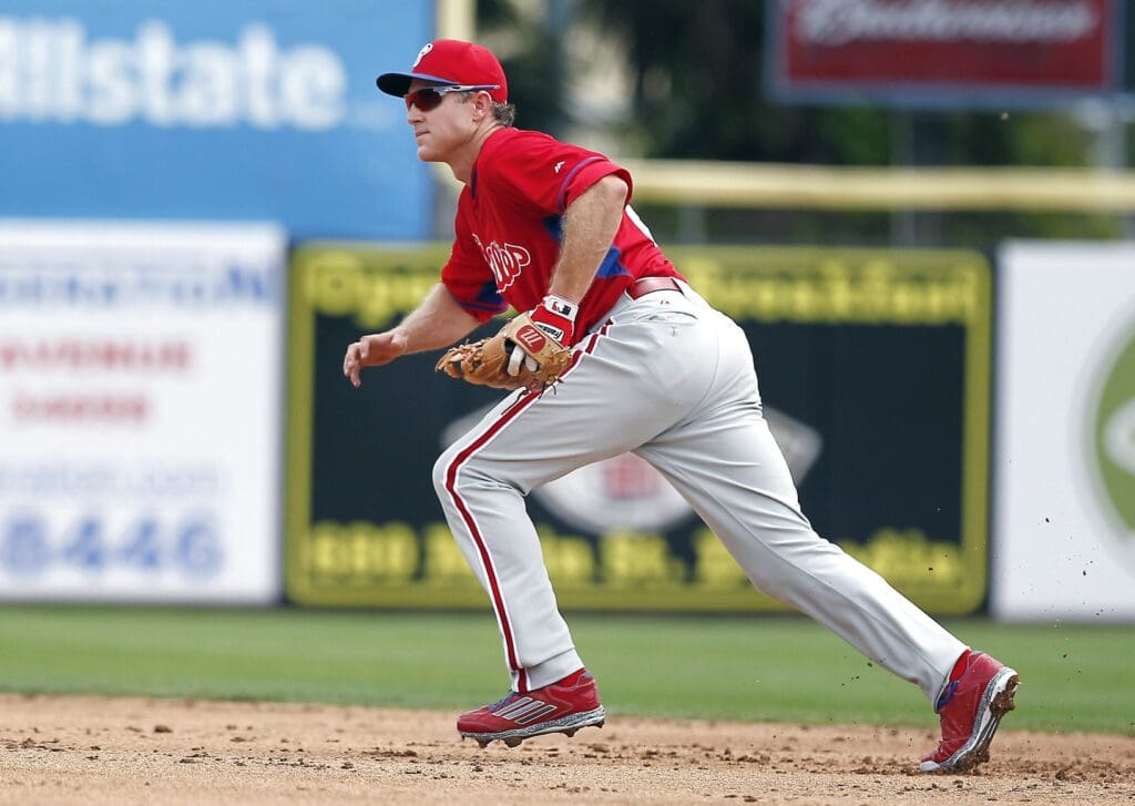 Mar 26, 2015; Dunedin, FL, USA; Philadelphia Phillies second baseman Chase Utley (26) chases a ground ball during a spring training baseball game at Florida Auto Exchange Park. The Toronto Blue Jays beat the Philadelphia Phillies 4-1.