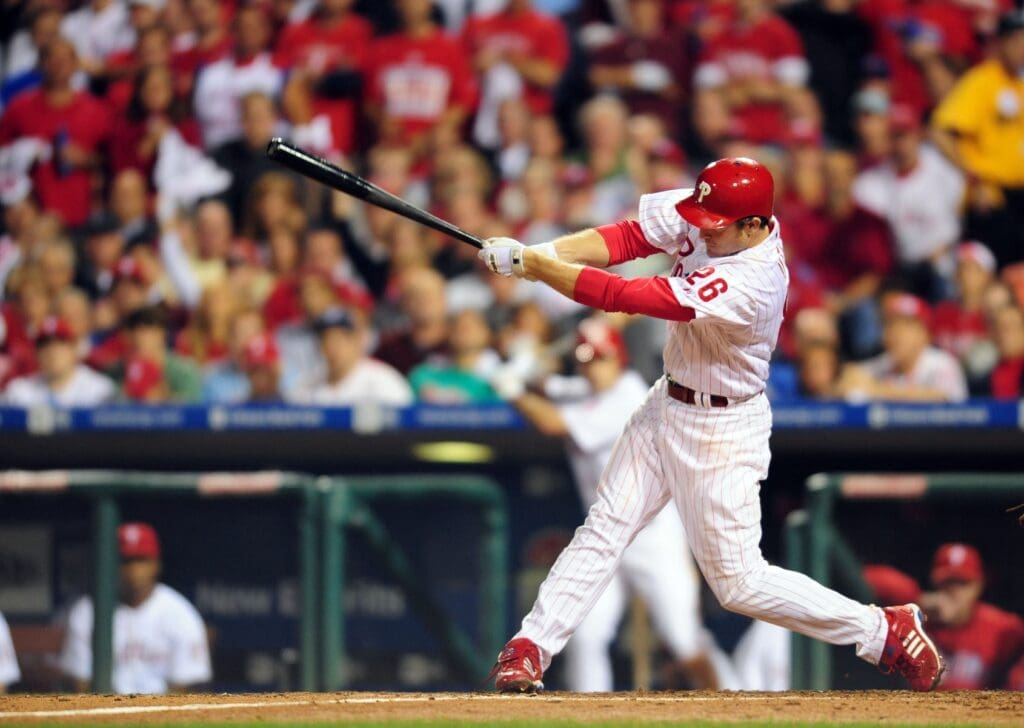 Oct 9, 2008; Philadelphia, PA, USA; Philadelphia Phillies second baseman Chase Utley (26) hits a two-run home run in the sixth inning against the Los Angeles Dodgers during game one of the NLCS at Citizens Bank Park. Philadelphia defeated Los Angeles 3-2.