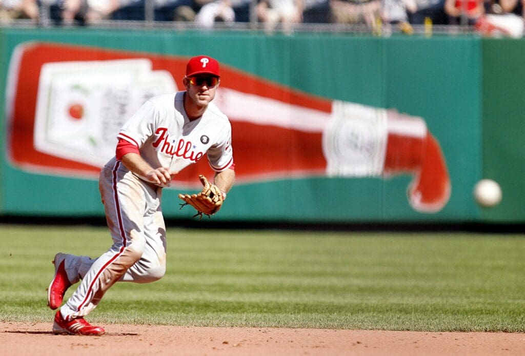 June 5, 2011; Pittsburgh,PA, USA: Philadelphia Phillies second baseman Chase Utley (26) chases a ground ball against the Pittsburgh Pirates during the eighth inning at PNC Park. The Phillies won 7-3.