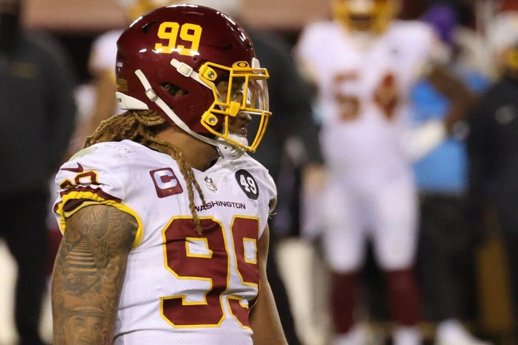 Jan 9, 2021; Landover, Maryland, USA; Washington Football Team defensive end Chase Young (99) stands on the field against the Tampa Bay Buccaneers at FedExField.