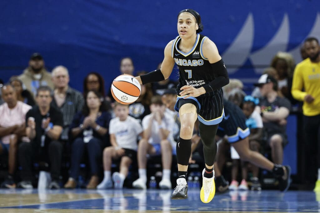 Aug 25, 2024; Chicago, Illinois, USA; Chicago Sky guard Chennedy Carter (7) brings the ball up court against the Las Vegas Aces during the first half at Wintrust Arena.