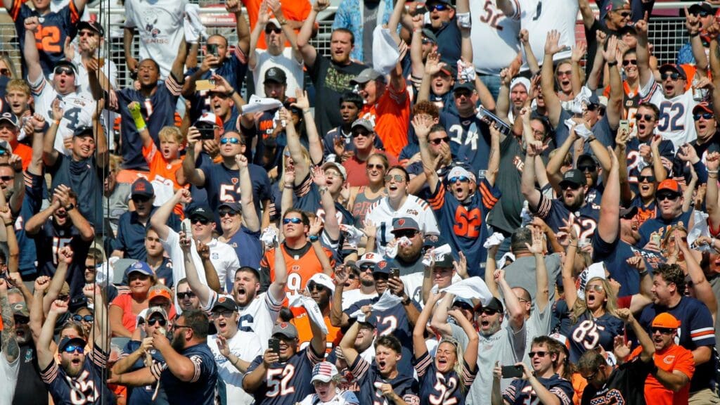 Sep 19, 2021; Chicago, Illinois, USA; Chicago Bears fans celebrate a touchdown against the Cincinnati Bengals during the first quarter at Soldier Field