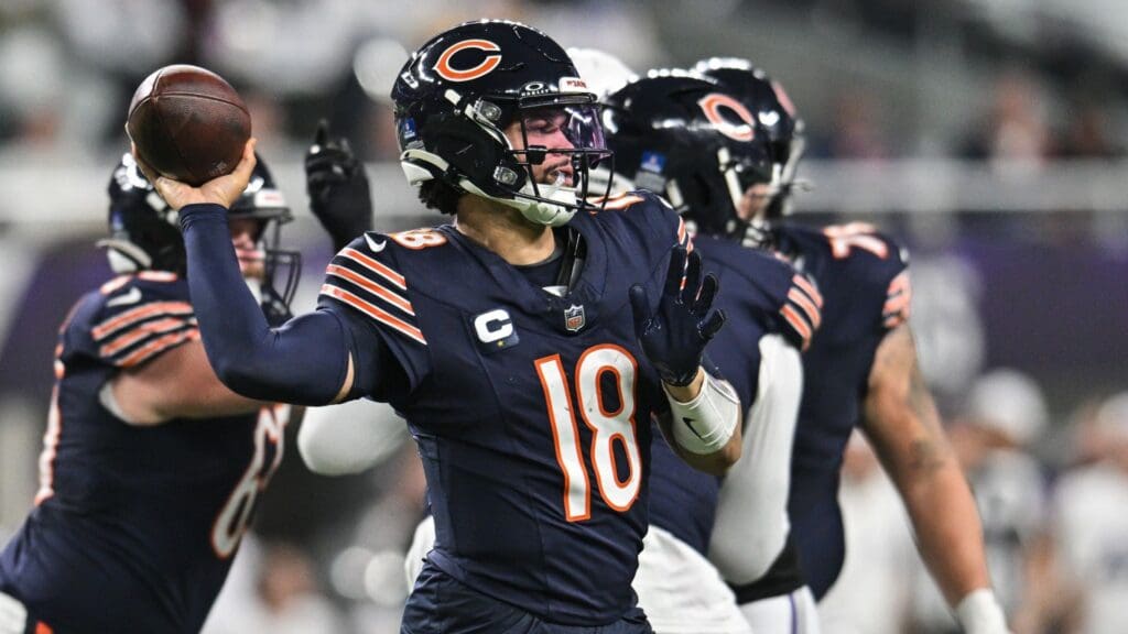 Dec 16, 2024; Minneapolis, Minnesota, USA; Chicago Bears quarterback Caleb Williams (18) throws a pass against the Minnesota Vikings during the fourth quarter at U.S. Bank Stadium.
