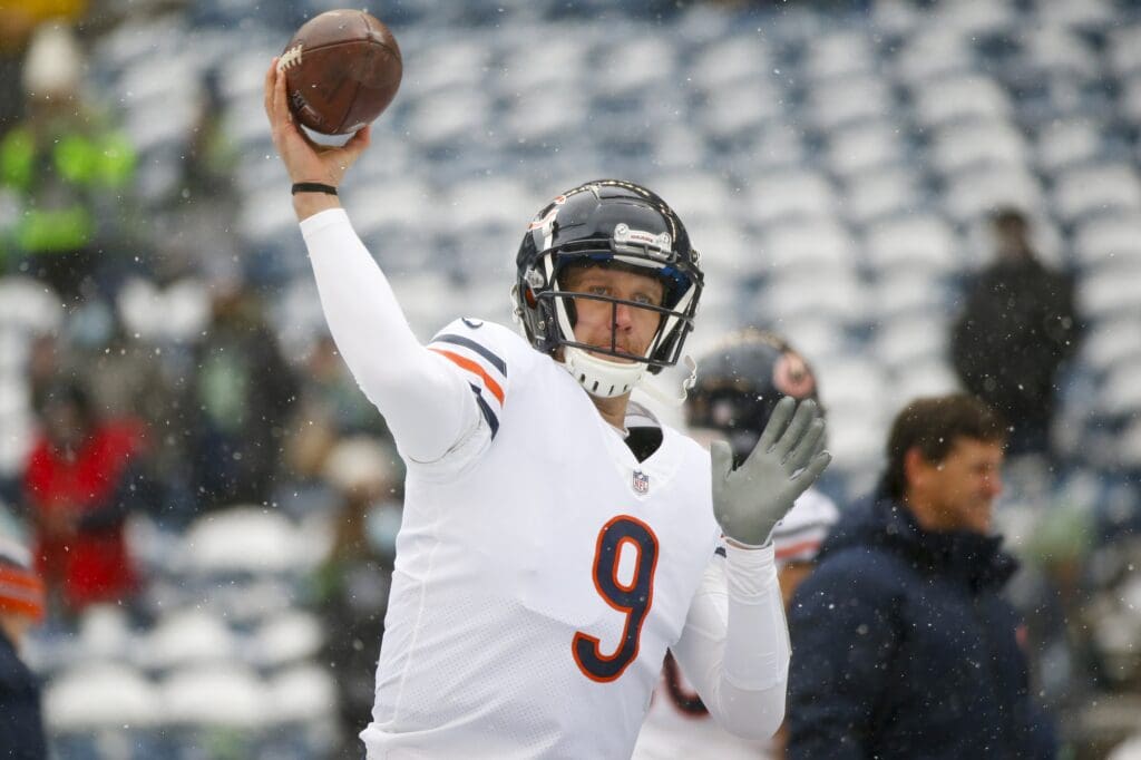 Dec 26, 2021; Seattle, Washington, USA; Chicago Bears quarterback Nick Foles (9) pwasses during pregame warmups against the Seattle Seahawks at Lumen Field