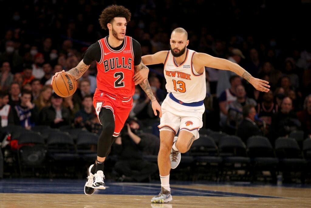 Dec 2, 2021; New York, New York, USA; Chicago Bulls guard Lonzo Ball (2) brings the ball up court against New York Knicks guard Evan Fournier (13) during the third quarter at Madison Square Garden.