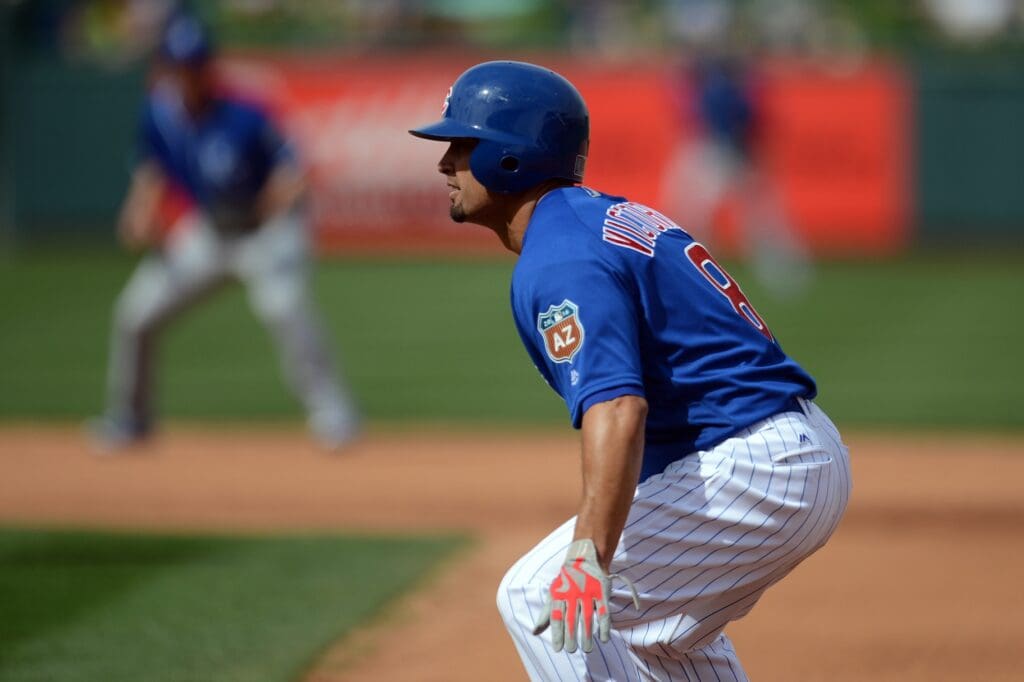 Chicago Cubs right fielder Shane Victorino (8) leads off of first base during the fourth inning against the Kansas City Royals at Sloan Park