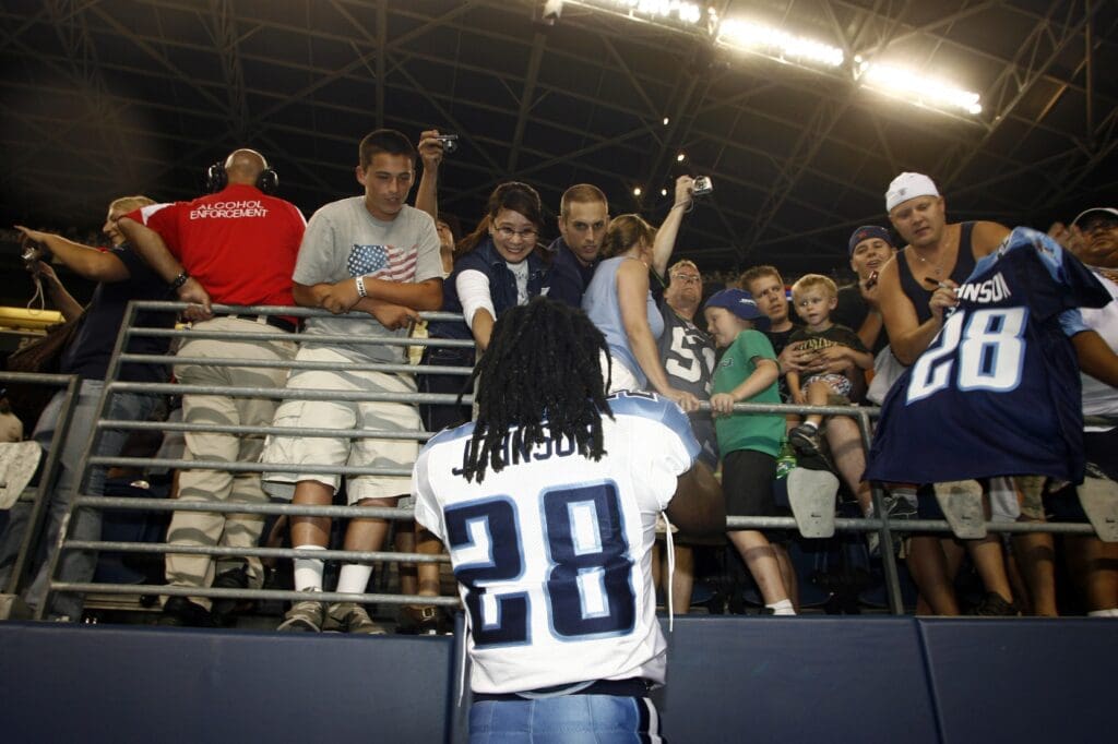August 14, 2010, Seattle, WA, USA; Tennessee Titans running back Chris Johnson (28) signs autographs for fans following the Titans 20-18 defeat to the Seattle Seahawks at Qwest Field.