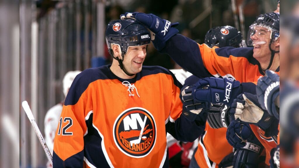 Oct 21, 2006; Uniondale, NY, USA; New York Islanders left wing Chris Simon (12) celebrates with teammates against the Carolina Hurricanes at Nassau Veterans Memorial Coliseum.