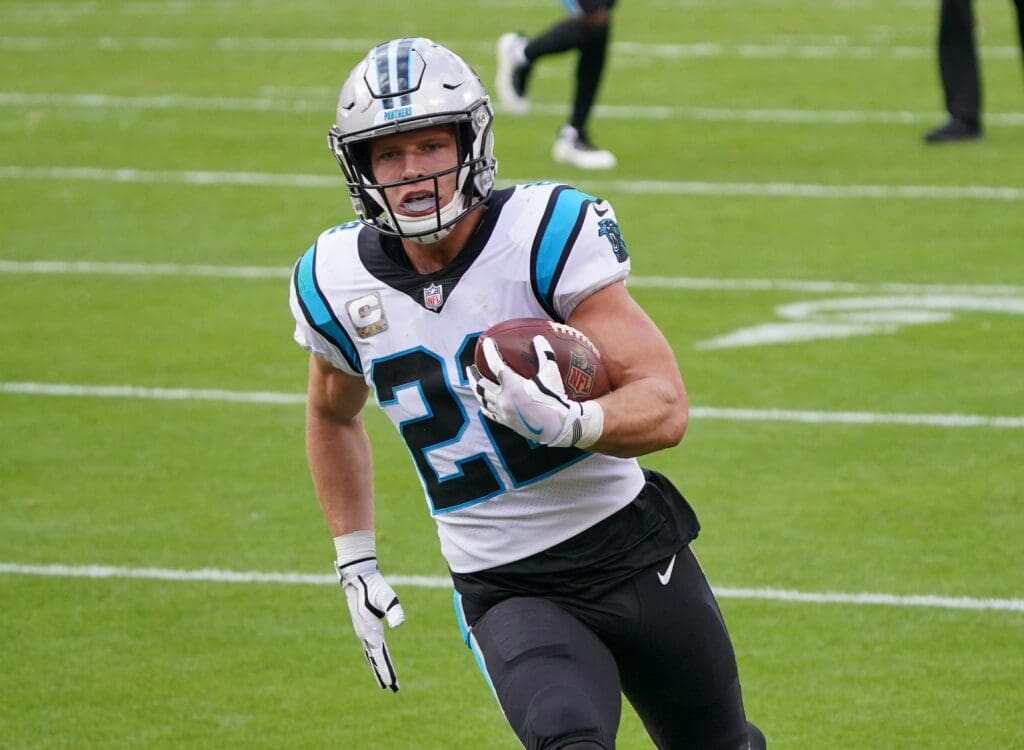 Nov 8, 2020; Kansas City, Missouri, USA; Carolina Panthers running back Christian McCaffrey (22) scores a touchdown against the Carolina Panthers during the first half at Arrowhead Stadium.
