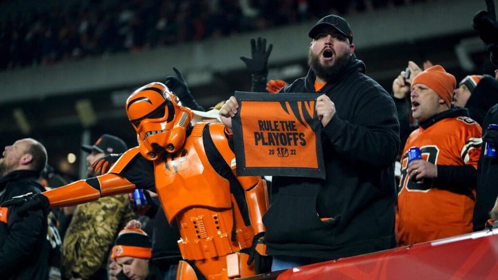 Cincinnati Bengals fans cheer on team after a touchdown by Cincinnati Bengals quarterback Joe Burrow (9) (not pictured) in the third quarter during an NFL wild-card playoff football game between the Baltimore Ravens and the Cincinnati Bengals, Sunday, Jan. 15, 2023, at Paycor Stadium in Cincinnati. The Cincinnati Bengals won, 24-17. The Cincinnati Bengals advance with the win to play the Buffalo Bills in the divisional round. Baltimore Ravens At Cincinnati Bengals Afc Wild Card Jan 15 0523