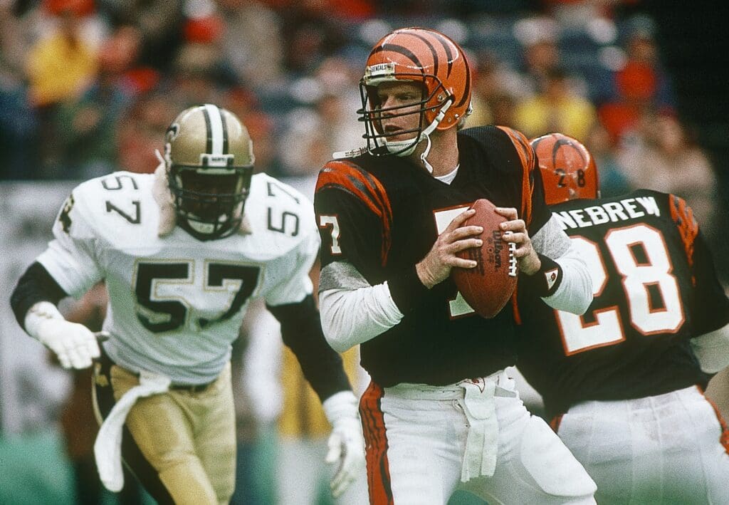 Dec 20, 1987; Cincinnati, OH, USA; FILE PHOTO; Cincinnati Bengals quarterback Boomer Esiason (7) in action against New Orleans Saints linebacker Rickey Jackson (57) at Riverfront Stadium.