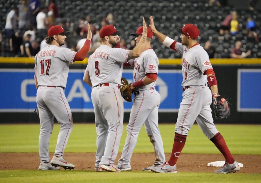 Jun 13, 2022; Phoenix, Arizona, U.S.; Cincinnati Reds players celebrate after beating the Arizona Diamondbacks 5-4 at Chase Field. Mlb Reds At Diamondbacks Cincinnati Reds At Arizona Diamondbacks