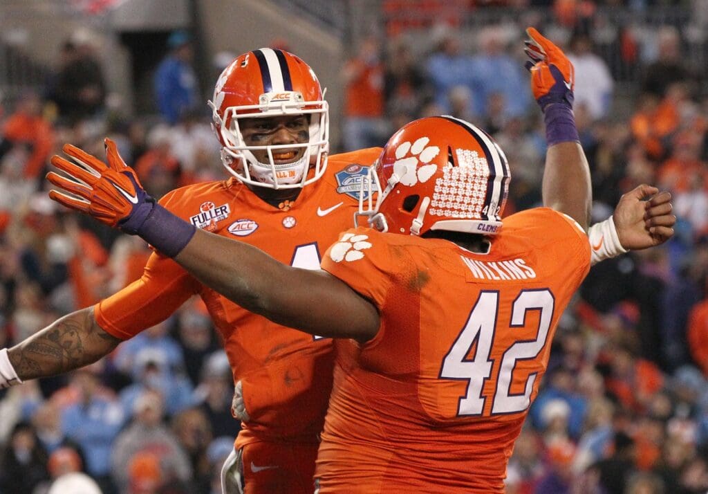 Clemson quarterback Deshaun Watson (4) celebrates with teammate Clemson defensive lineman Christian Wilkins (42) during the fourth quarter of the ACC Championship game in Charlotte, North Carolina.