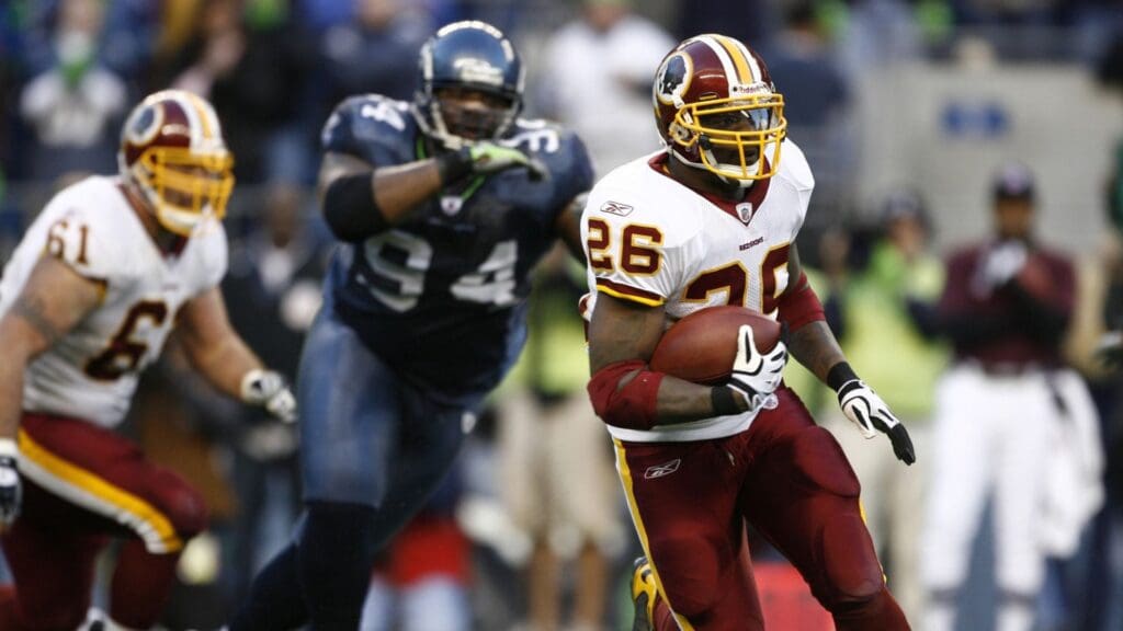 Nov 23, 2008; SEATTLE, WA, USA; Washington Redskins running back Clinton Portis (26) rushes against the Seattle Seahawks during the second half at Qwest Field. Washington defeated Seattle, 20-17.