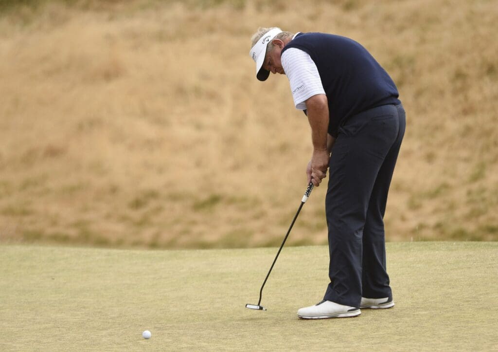 Jun 18, 2015; University Place, WA, USA; Colin Montgomerie putts on the 6th green in the first round of the 2015 U.S. Open golf tournament at Chambers Bay. 