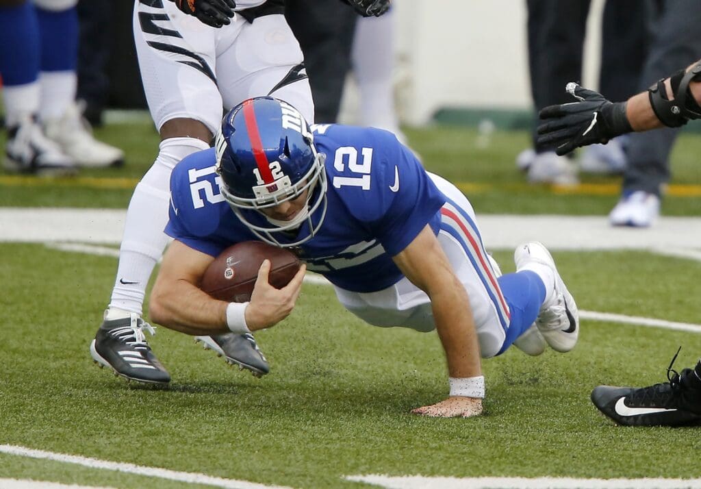 Nov 29, 2020; Cincinnati, Ohio, USA; New York Giants quarterback Colt McCoy (12) dives for the first down during the third quarter against the Cincinnati Bengals at Paul Brown Stadium.