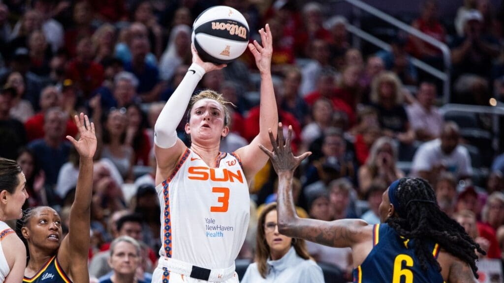 Jun 17, 2025; Indianapolis, Indiana, USA; Connecticut Sun guard Marina Mabrey (3) shoots the ball while Indiana Fever forward Natasha Howard (6) defends in the second half at Gainbridge Fieldhouse.