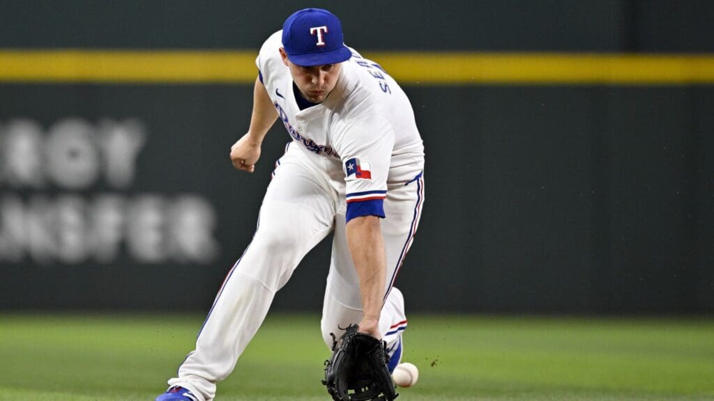 Jun 19, 2025; Arlington, Texas, USA; Texas Rangers shortstop Corey Seager (5) fields a ground ball hit by Kansas City Royals catcher Freddy Fermin (not pictured) during the fifth inning at Globe Life Field.