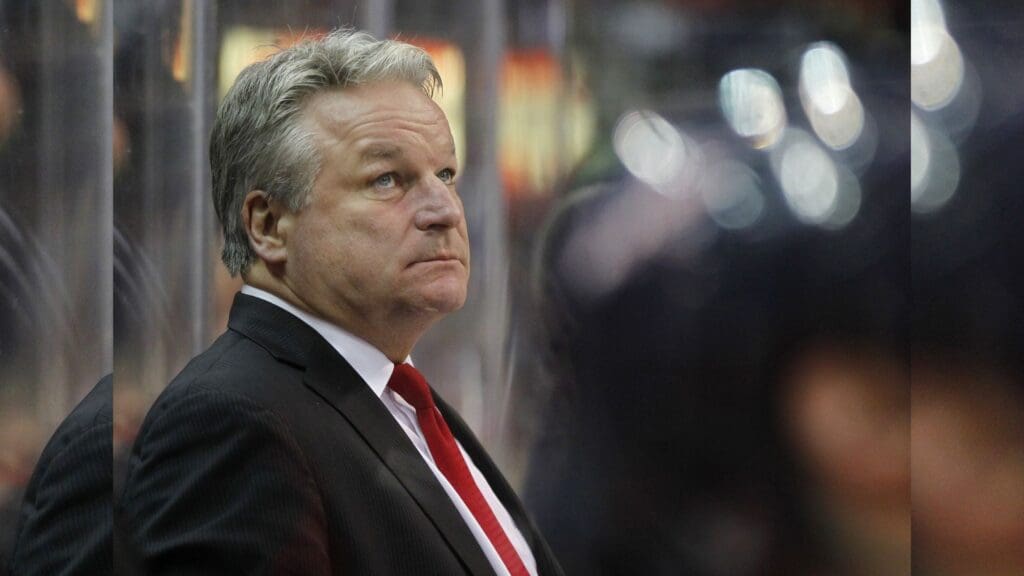 January 3, 2012; Washington, DC, USA; Washington Capitals head coach Dale Hunter watches from the bench against the Calgary Flames in the third period at Verizon Center. The Capitals won 3-1.