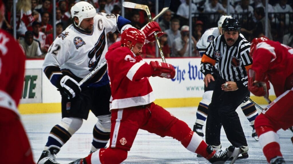 Feb 1, 1998; Washington, DC, USA; FILE PHOTO; Detroit Red Wings defensemen Bob Rouse (3) in action against Washington Capitals center Dale Hunter (32) at the MCI Center.